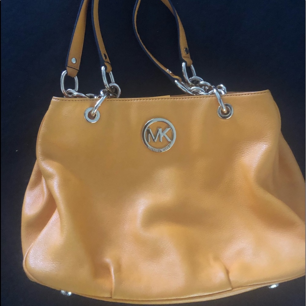 Gently used Michael Kors yellow and gold purse